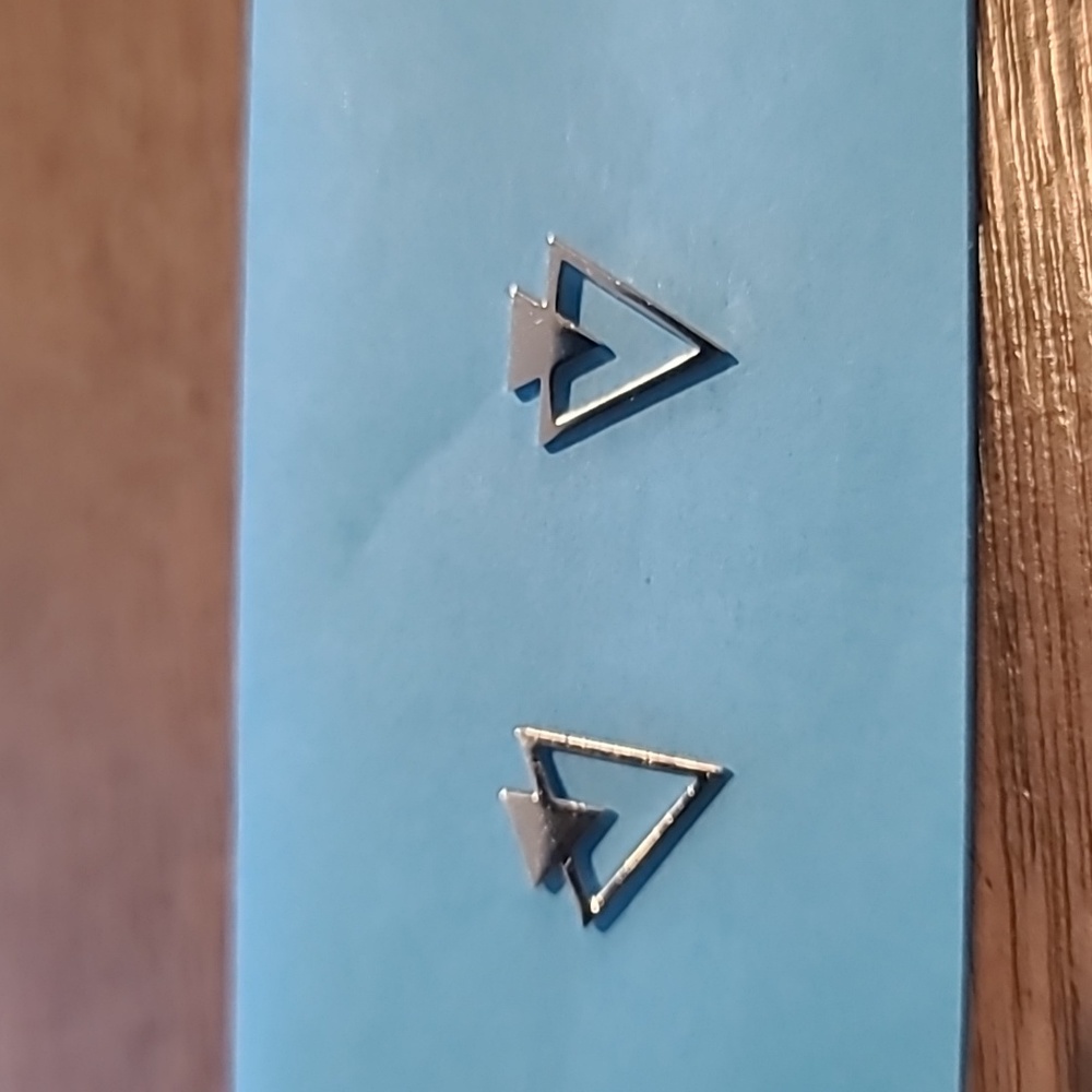 Silver tone triangle earrings